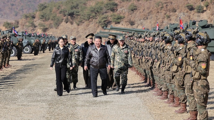 North Korean leader Kim Jong Un, accompanied by his daughter Kim Ju Ae, supervises what North Korean state news agency KCNA reports is an offensive tactical drill involving a new type of tank, at a training base in Pyongyang, North Korea (Photo- Reuters)