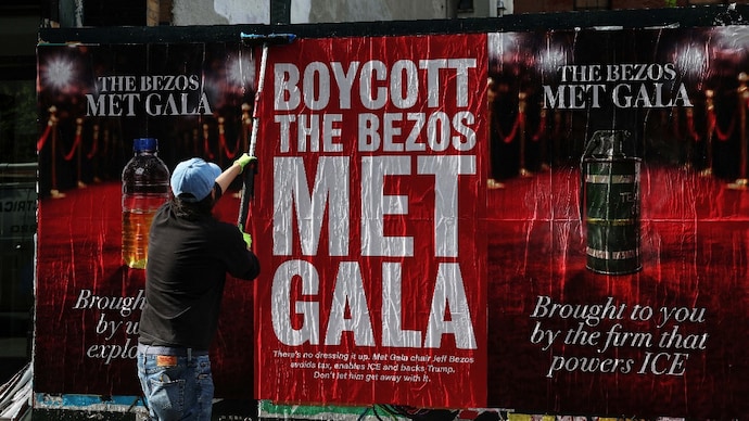 A man puts up a "Boycott The Bezos Met Gala" poster in the Midtown area of New York City (Photo: REUTERS/Shannon Stapleton) A man puts up a "Boycott The Bezos Met Gala" poster in the Midtown area of New York City