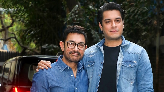 Aamir Khan (left) praised his son Junaid ahead of the release of Ek Day. (Credit: PTI) Aamir Khan with son Junaid