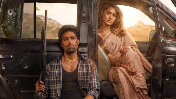 A poster of the film Dacoit, starring Adivi Sesh and Mrunal Thakur.