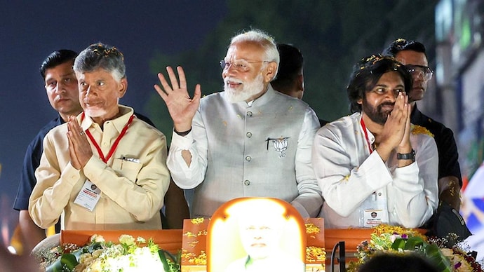 PM Modi along with TDP chief N Chandrababu Naidu and Pawan Kalyan during a roadshow in Andhra Pradesh Andhra Pradesh elections