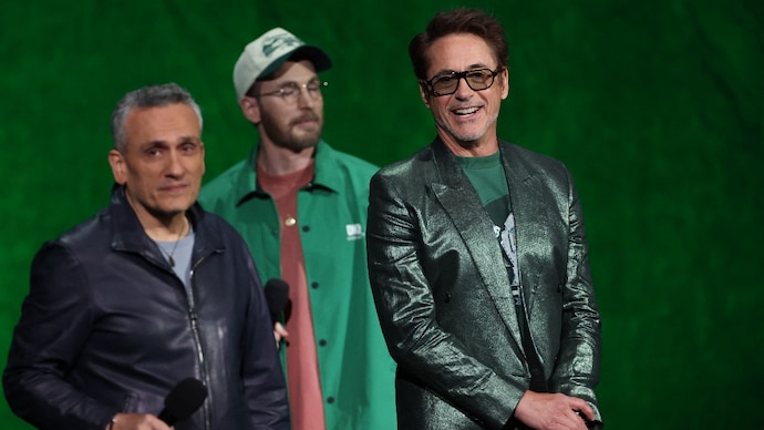 Chris Evans (C), Robert Downey Jr. (R) and filmmaker Joe Russo (L) promote "Avengers: Doomsday" at CinemaCon in Las Vegas. (Photo by VALERIE MACON / AFP) Robert Downey Jr., Joe Russo and Chris Evans at CinemaCon 2026.