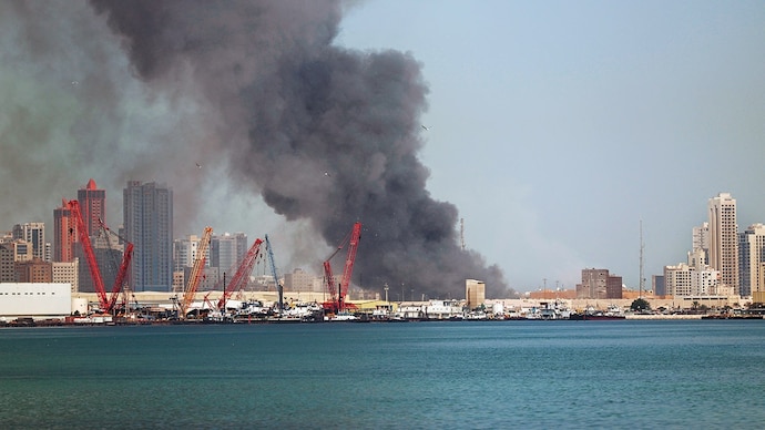 EYE OF THE STORM: Smoke rises after Iran carried out a missile strike on the US 5th Fleet headquarters in Manama, Feb. 28. (Photo: AFP)
