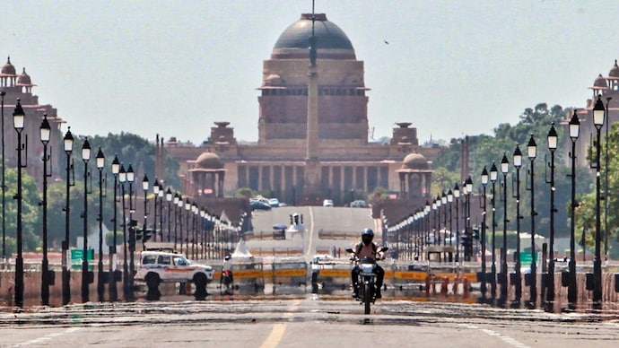 A biker cruises along the Kartavya Path as mirage appears on a hot summer day, in New Delhi. (Photo: PTI) Delhi heatwave