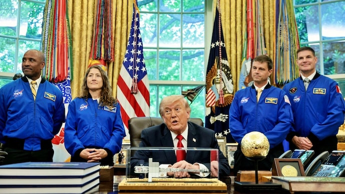 Artemis II astronauts flank US President Donald Trump as he speaks during an event in the Oval Office. (Photo: Reuters) Donald Trump Artemis-2