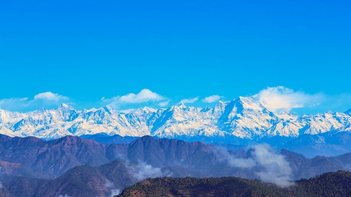 A view of the Himalayas under the blue sky. (Photo: PTI) Experts warn development plans in the Himalayas need urgent overhaul