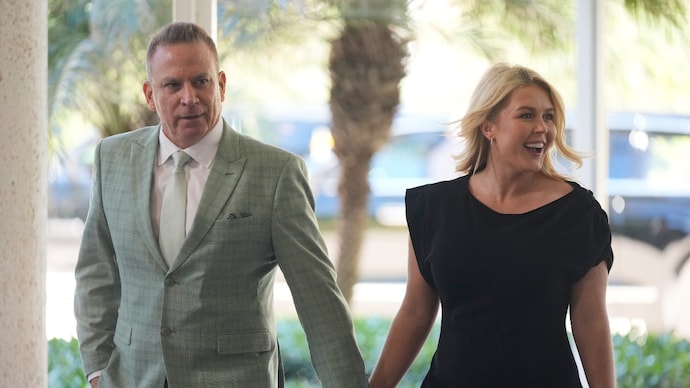 Karoline Leavitt's husband, Nicholas Riccio (L) was reported to have warned a Fox News correspondent of the shooting at the White House Correspondent's Dinner ahead of the event. (Image: AP/Mark Schiefelbein) Fox News cuts live feed as reporter recalls warning after dinner shooting.