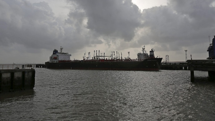A vessel awaits entry into the container terminal of Jawaharlal Nehru Port Trust (JNPT) in Mumbai. (Image: Reuters) global energy crisis oil shortage in india vessels indian flagged uae saudi qatar iran bypass us blockade strait of hormuz mumbai kochi surat port