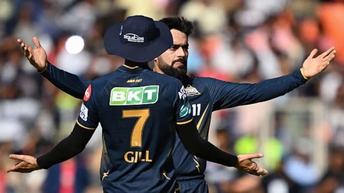 IPL: Rashid Khan has a new delivery. (Getty Photo) Gujarat Titans' Rashid Khan (R) celebrates with captain Shubman Gill (Getty)