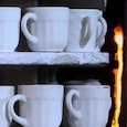 In a Khurja ceramic factory, mugs head into the kiln. Due to the LPG shortage, kilns across all 300 units are not able to run. (Image: Meenal Sharma) In a Khurja ceramic factory, mugs head into the kiln. Due to the LPG shortage, kilns across all 300 units are not able to run. (Image: Meenal Sharma)