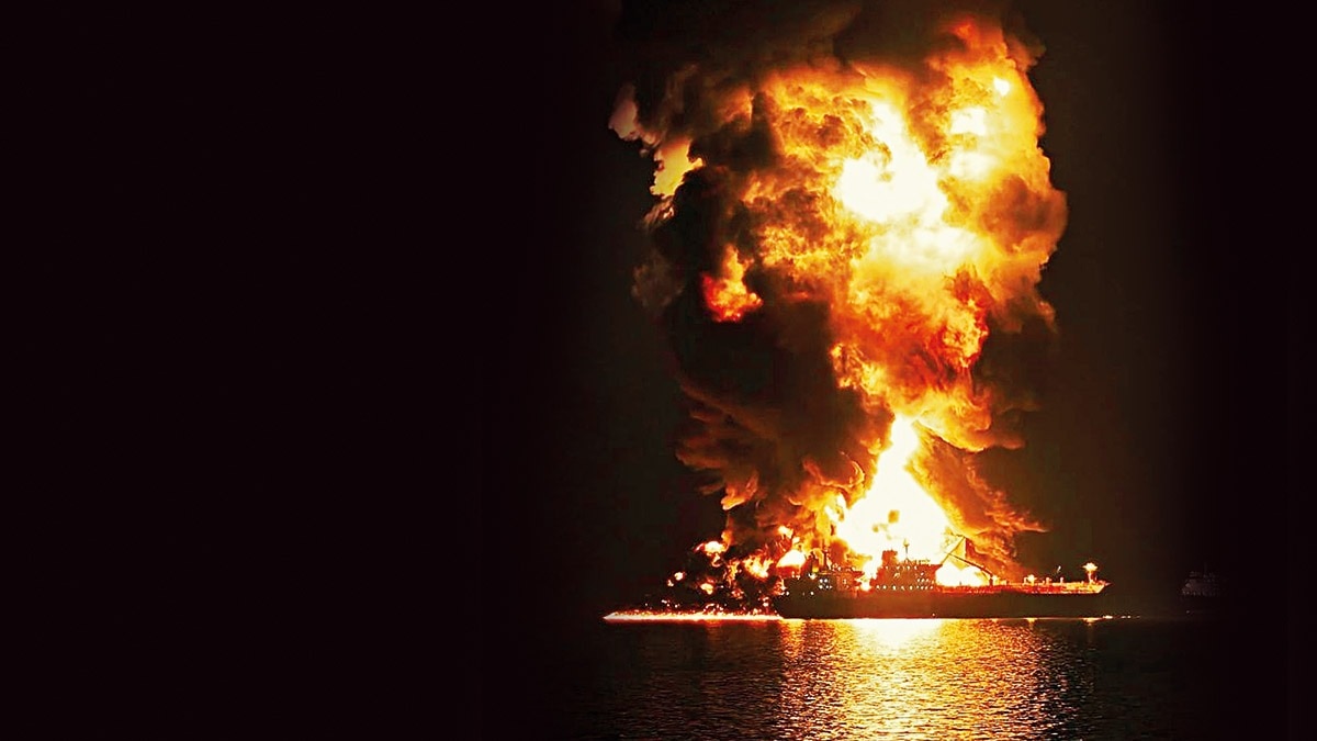 TOWERING INFERNO: An oil tanker hit by Iran at the Khor Al Zubair port near Basra, Iraq, Mar. 11. (Photo: AP)