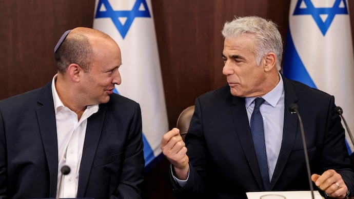 Israel's Yair Lapid, right, talks with former Prime Minister Naftali Bennett (File Photo: AP) Israel's Yair Lapid, right, talks with former Prime Minister Naftali Bennett (File Photo: AP)