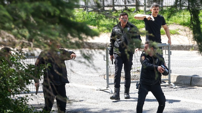 Police present at the spot where gunfire was heard outside a building housing the Israeli consulate in Istanbul. (Photo: Reuters)