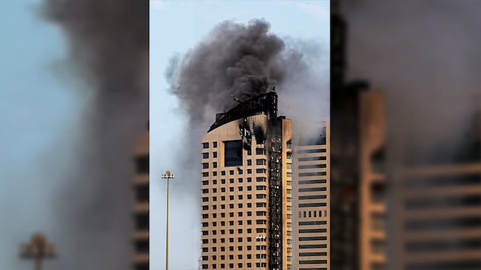 PLUMES OF WORRY: A highrise building hit in a drone attack in Kuwait City, Mar. 8. (Photo: AFP)