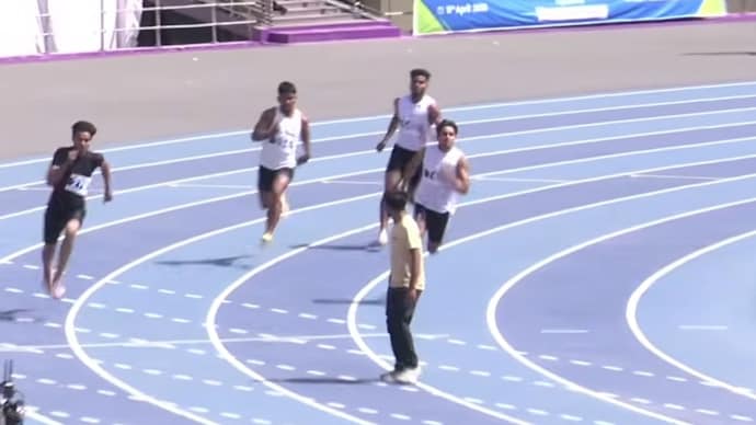 Man walks onto track mid junior 200m race in Delhi, sparking backlash over AFI lapse. (Image: Screengrab/AFI) Man walks onto track mid junior 200m race in Delhi, sparking backlash over AFI lapse. (Image: Screengrab/AFI)