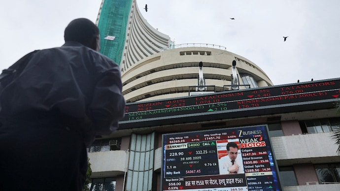 A man looks at a screen outside the Bombay Stock Exchange (BSE) in Mumbai. (Photo: Reuters)