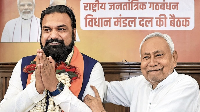 BIG BOOTS: Nitish Kumar handing off the reins to Samrat Choudhary at the NDA legislators’ meet, Patna, Apr. 14. (Photo: PTI)