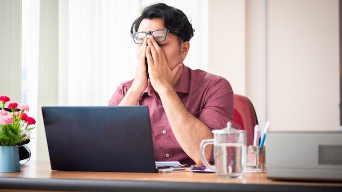 The World Health Organisation reported a 25% rise in anxiety cases after Covid-19, highlighting how widespread the issue has become. (Photo: Getty Images) Office Worker Looking Stress