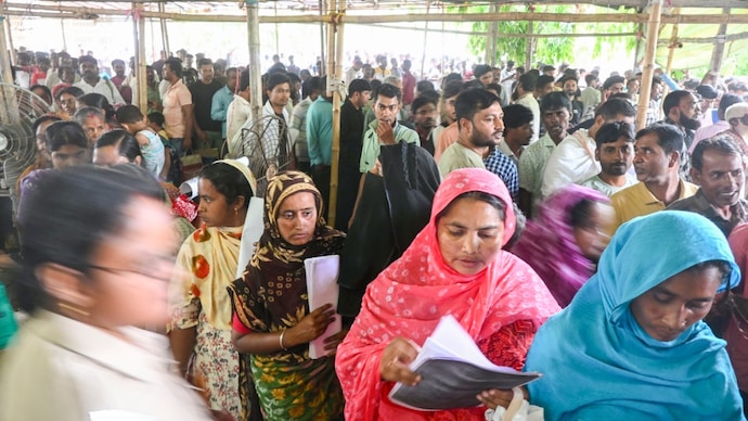 People, whose names were deleted from voters' lists in the ongoing Special Intensive Revision (SIR) of electoral rolls in poll-bound West Bengal, queue up to present their cases before judicial officers. (PTI) People, whose names were deleted from voters' lists in the ongoing Special Intensive Revision (SIR) of electoral rolls in poll-bound West Bengal, queue up to present their cases before judicial officers. (PTI)