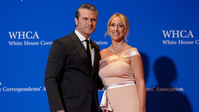 Pete Hegseth and his wife Jennifer Rauchet pose for photographers at the annual White House Correspondents' Association Dinner on April 25, 2026. (Photo: AP) Pete Hegseth