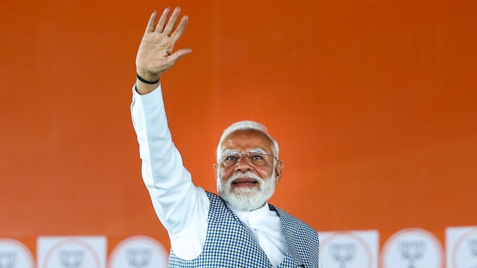 Prime Minister Narendra Modi waves at the crowd during a rally at Barrackpore in West Bengal's North 24 Parganas district. (Photo: PTI)