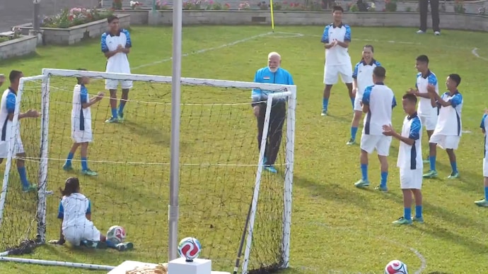 PM Modi playing football with children in Sikkim. (Photo: Screengrab) PM Modi playing football with children in Sikkim.