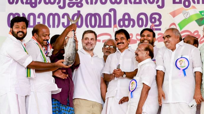 Congress MP Rahul Gandhi with party leader KC Venugopal and others at a rally in Kerala's Alapuzzha. (Photo: PTI)