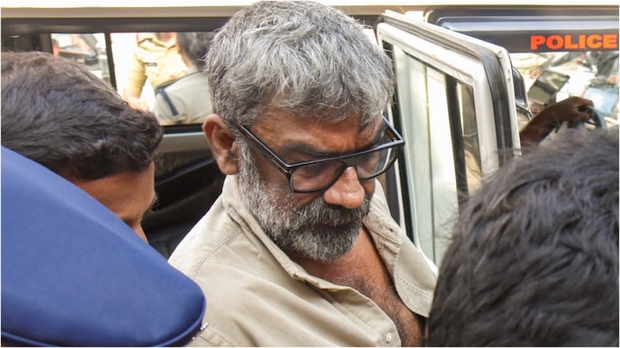 Malayalam film director Ranjith is being taken to sub-jail after medical examination at Ernakulam General Hospital in Kochi, Kerala. Photo: PTI Ranjit