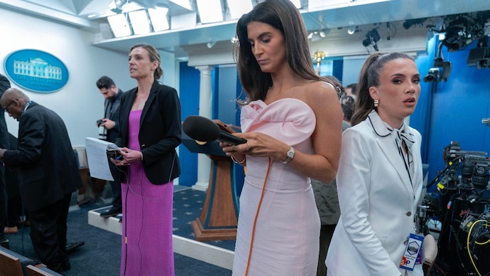 Reporters dressed in evening gowns gala wait for President Donal Trump to speak (Photo- AP)