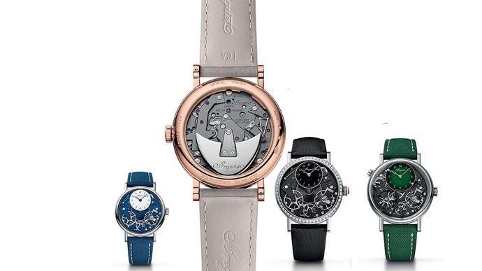 Breguet’s refreshed Tradition lineup, clockwise from left: the blue Seconde Rétrograde 7037, the rose-gold 7097 seen caseback-first, the black aventurine Seconde Rétrograde 7038, and the green Grand Feu enamel GMT 7067