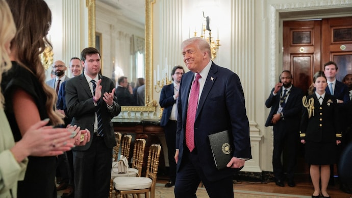 Trump attends an event to delivers remarks to NCAA Collegiate Champions in the State Dining Room at the White House. Trump attends an event to delivers remarks to NCAA Collegiate Champions in the State Dining Room at the White House.
