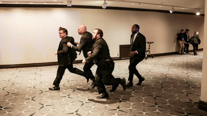 US House Speaker Mike Johnson (R-LA) is evacuated as a shooter opens fire during the annual White House Correspondents' Association dinner in Washington, D.C., US (Photo- Reuters)