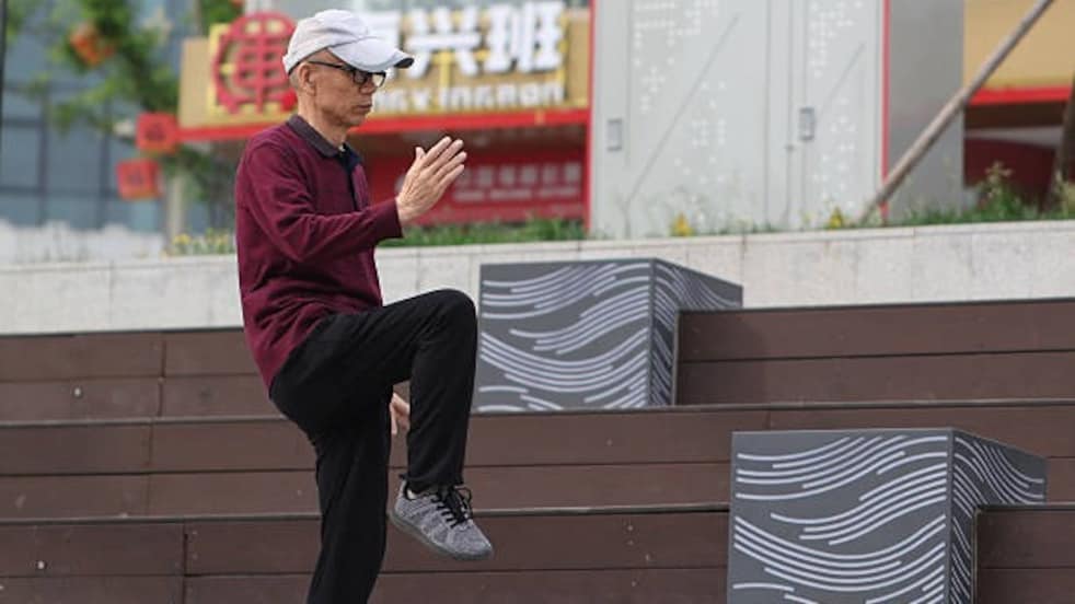 An eldelry man practising Tai Chi