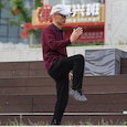 An eldelry man practising Tai Chi An eldelry man practising Tai Chi
