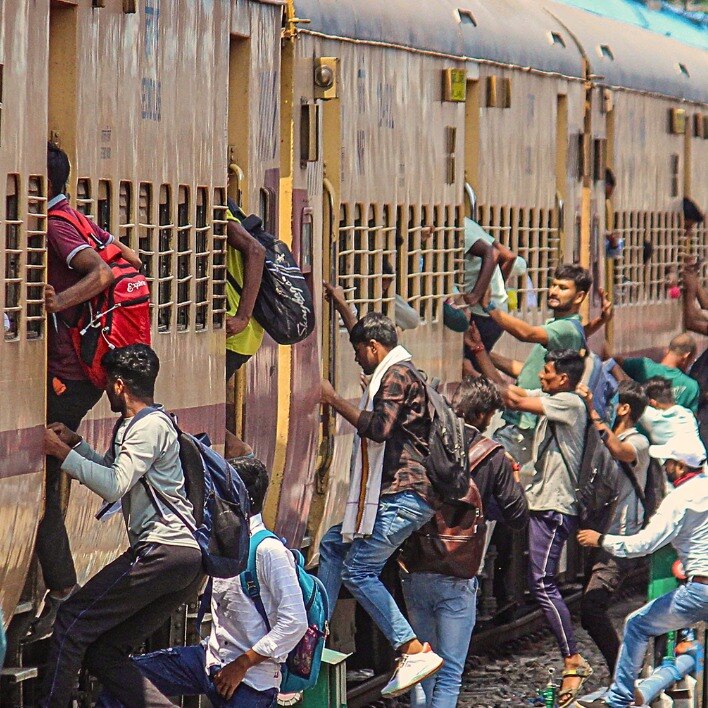 Aspirants of the UP Police recruitment exam rush to board a train at a railway station in Meerut. (Image for representation: PTI)