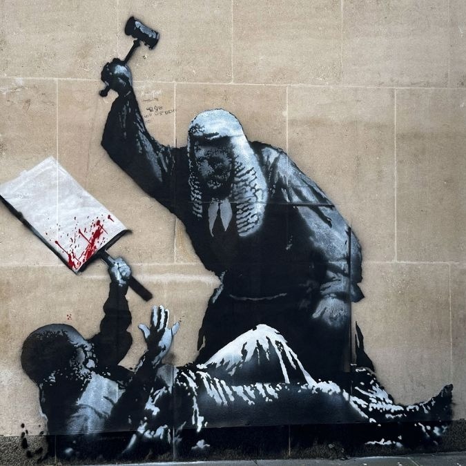 Banksy unveils surprise London statue of man with flag blown into his face