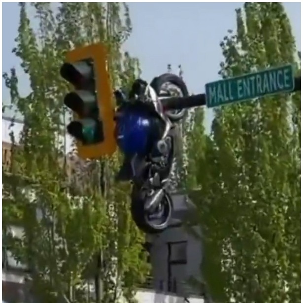 Bike flung mid-air in Canada crash, ends up hanging from traffic pole