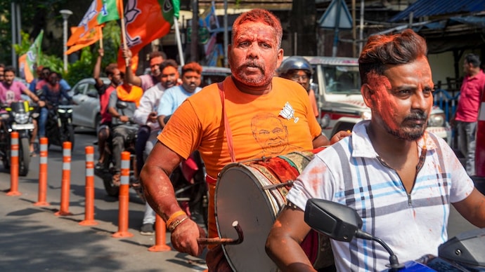 BJP supporters celebrate party's lead near the residence of West Bengal Chief Minister Mamata Banerjee during vote tabulation on the day of Assembly election results, in Kolkata. (PTI) BJP supporters celebrate party's lead near the residence of West Bengal Chief Minister Mamata Banerjee during vote tabulation on the day of Assembly election results, in Kolkata. (PTI)
