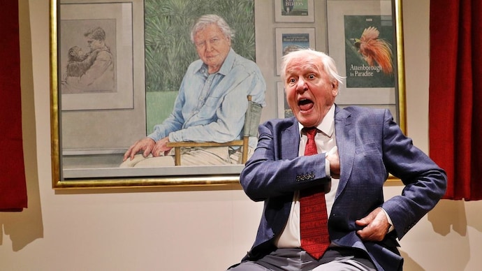 David Attenborough reacts next to a portrait of himself by Bryan Organ to mark his 90th birthday at New Walk Museum and Art Gallery in Leicester, Britain. (Photo: Reuters) David Attenborough turns 100
