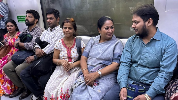 Delhi Chief Minister Rekha Gupta, second right, interacts with passengers while travelling in a metro train to the Delhi Secretariat. (Image: PTI) Delhi Chief Minister Rekha Gupta, second right, interacts with passengers while travelling in a metro train to the Delhi Secretariat. (Image: PTI)