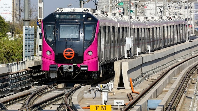 A Delhi Metro train runs on the newly-opened Deepali Chowk-Majlis Park section of the Magenta Line. (Photo: PTI)