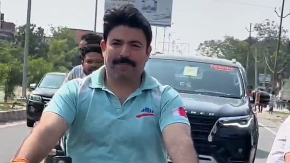 UP MLA rides bike without helmet, asks police to fine him Rs 1,000