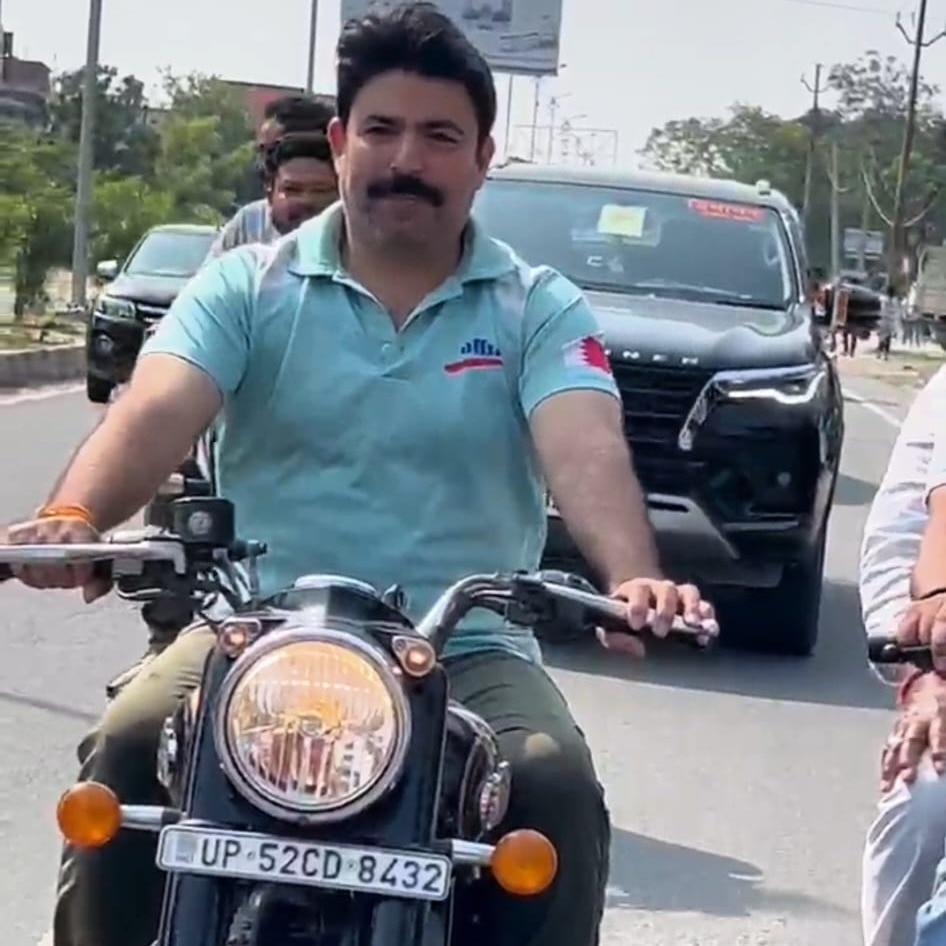 UP MLA rides bike without helmet, asks police to fine him Rs 1,000