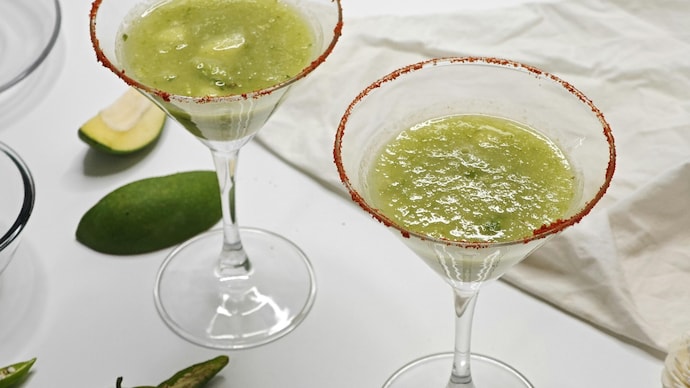 The piece lays out a simple homemade aam panna recipe using raw mangoes, mint and spices.