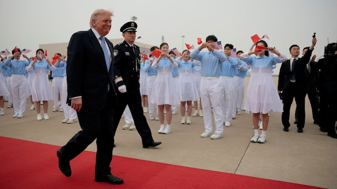US President Donald Trump walks towards Air Force One at Beijing Capital Airport Donald Trump China visit