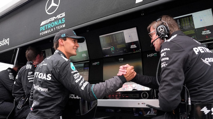 Mercedes' George Russell celebrates after qualifying in pole position. (Image: Reuters) George Russell
