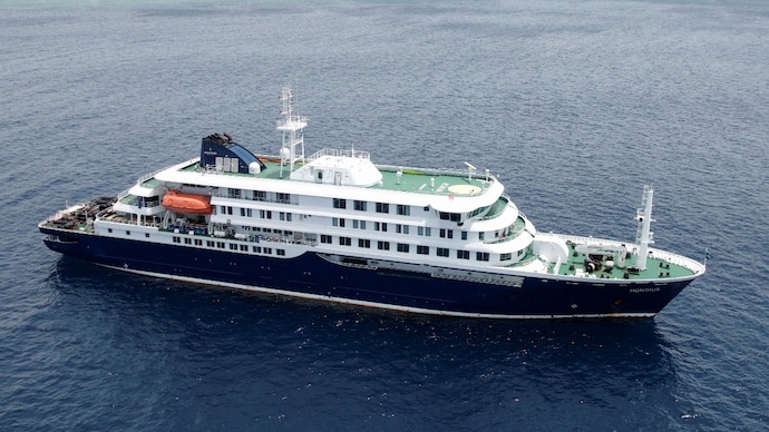 Reuters) A drone view of the cruise ship MV Hondius, carrying passengers suspected of having cases of hantavirus on board, as it prepares to leave Praia