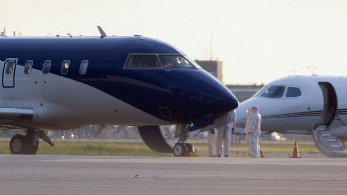Health workers in hazmat suits stand next to an air ambulance on the day hantavirus patients arrive at Schiphol Airport near Amsterdam, Netherlands. (Photo: Reuters) Health workers in hazmat suits stand next to an air ambulance on the day hantavirus patients arrive at Schiphol Airport near Amsterdam, Netherlands.