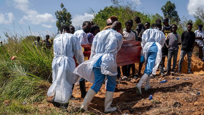 Health workers carry the coffin at the cemetery for the burial of a person suspected of having died from Ebola in Bunia, in the eastern Democratic Republic of the Congo. (Photo: AFP) Health workers carry the coffin at the cemetery for the burial of a person suspected of having died from Ebola in Bunia, in the eastern Democratic Republic of the Congo