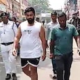 Howrah gangster Akash Singh (R) paraded in vest and underwear by police Howrah gangster Akash Singh (R) paraded in vest and underwear by police